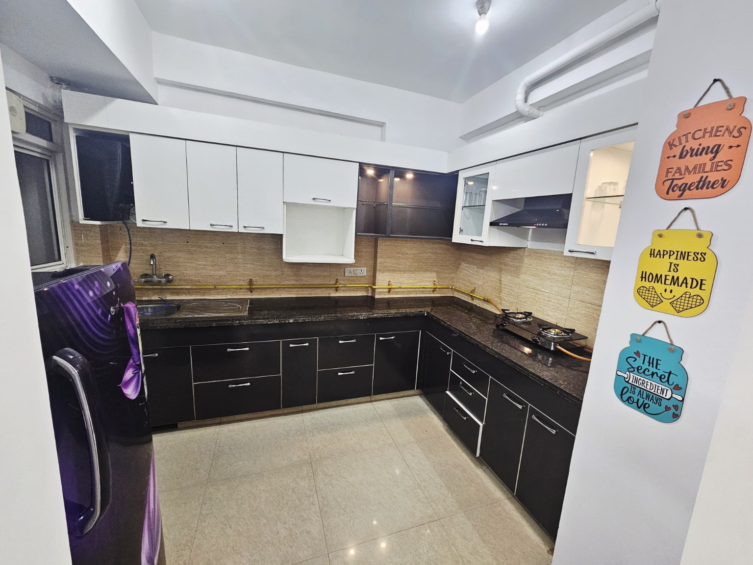 Fully equipped kitchen at Urban Nest Lucknow